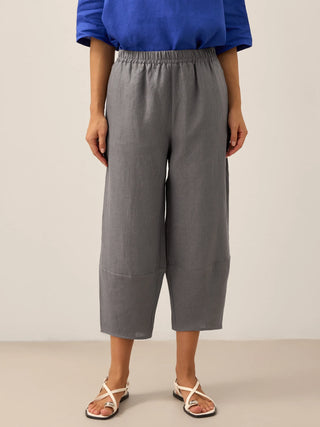 LINTICO 100% linen crop pants in neutral grey, featuring classic ankle-length design and relaxed fit for casual wear.