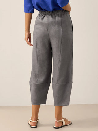 LINTICO Rory 100% linen crop pants in neutral grey, showcasing classic ankle-length design with a relaxed fit and lightweight fabric.