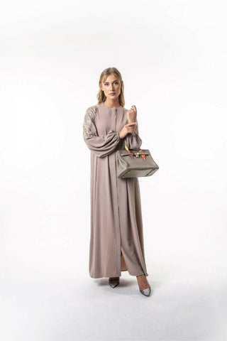 BY Baano Zoie Long Abaya with front zipper, flowing black abaya featuring a sleek design and full-length coverage.