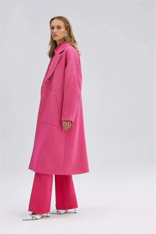Ladies pink Nina Tweeted Coat by Baano, showcasing a stylish fuchsia coat with a tailored fit and textured fabric.