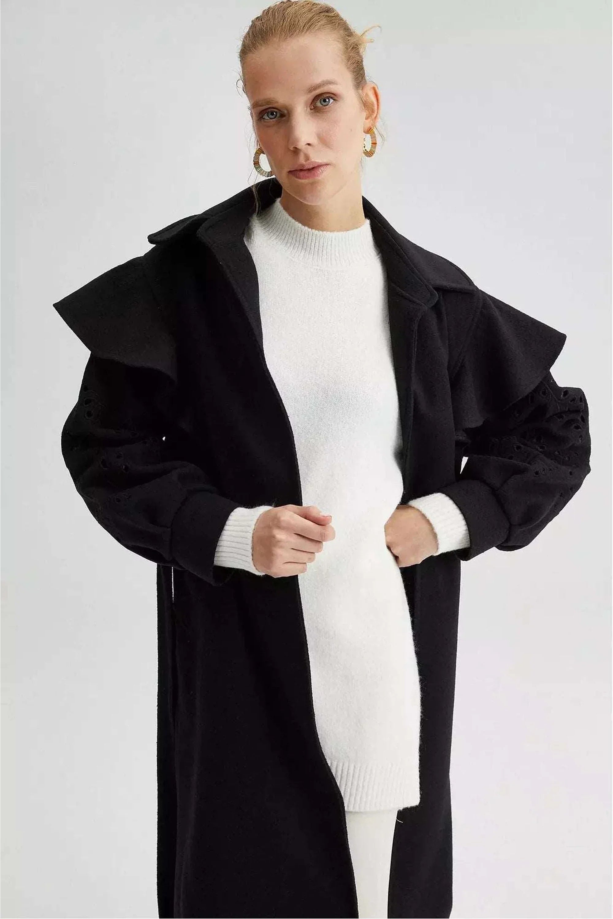 Black lace detailed coat with belt by By Baano, showcasing elegant design and tailored fit in a stylish coat and jacket.