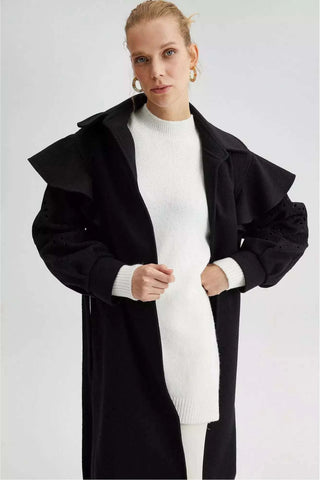 Black lace detailed coat with belt by By Baano, showcasing elegant design and tailored fit in a stylish coat and jacket.