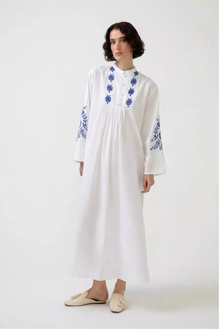 White embroidered dress with long sleeves by Baano, featuring intricate embroidery and elegant design.