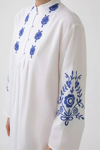 By Baano white embroidered dress with long sleeves, featuring intricate embroidery and a stylish fit, perfect for elegant occasions.