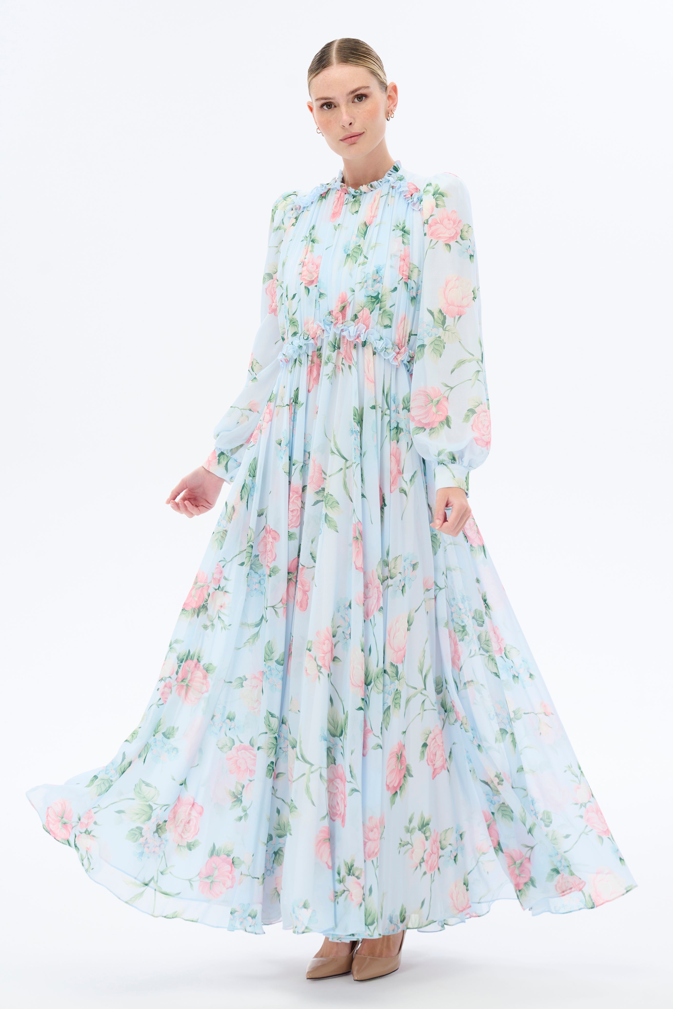 By Baano Morning Blues floral long maxi dress with long sleeves, featuring a flowing design and vibrant blue floral pattern.