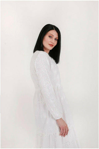 White cotton Sienna midi dress by BY Baano, featuring a flowing silhouette and elegant design, shown on a model.
