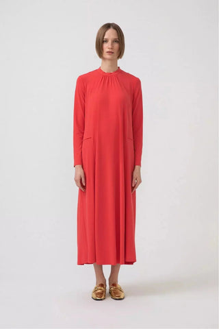 Orange premium jersey dress by Baano, lightweight and stylish, shown on a model with a relaxed fit and simple design.