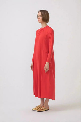 Orange premium quality jersey dress by By Baano, shown on a model, highlighting the soft fabric and stylish fit.