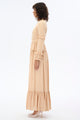 Beige high collar lace dress by By Baano featuring intricate lace details and a stylish high neckline.