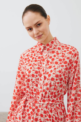 By Baano Peyton long sleeve dress in persimmon, featuring a fitted silhouette and stylish design, perfect for casual or dressy occasions.