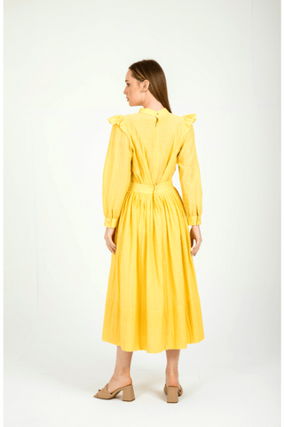 Yellow Ruya picnic dress with ruffles by BY Baano, featuring a flowy, summery design perfect for outdoor gatherings.