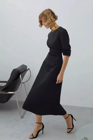By Baano midnight navy satin midi evening dress with rhinestones, showcasing elegant design and intricate embellishments.