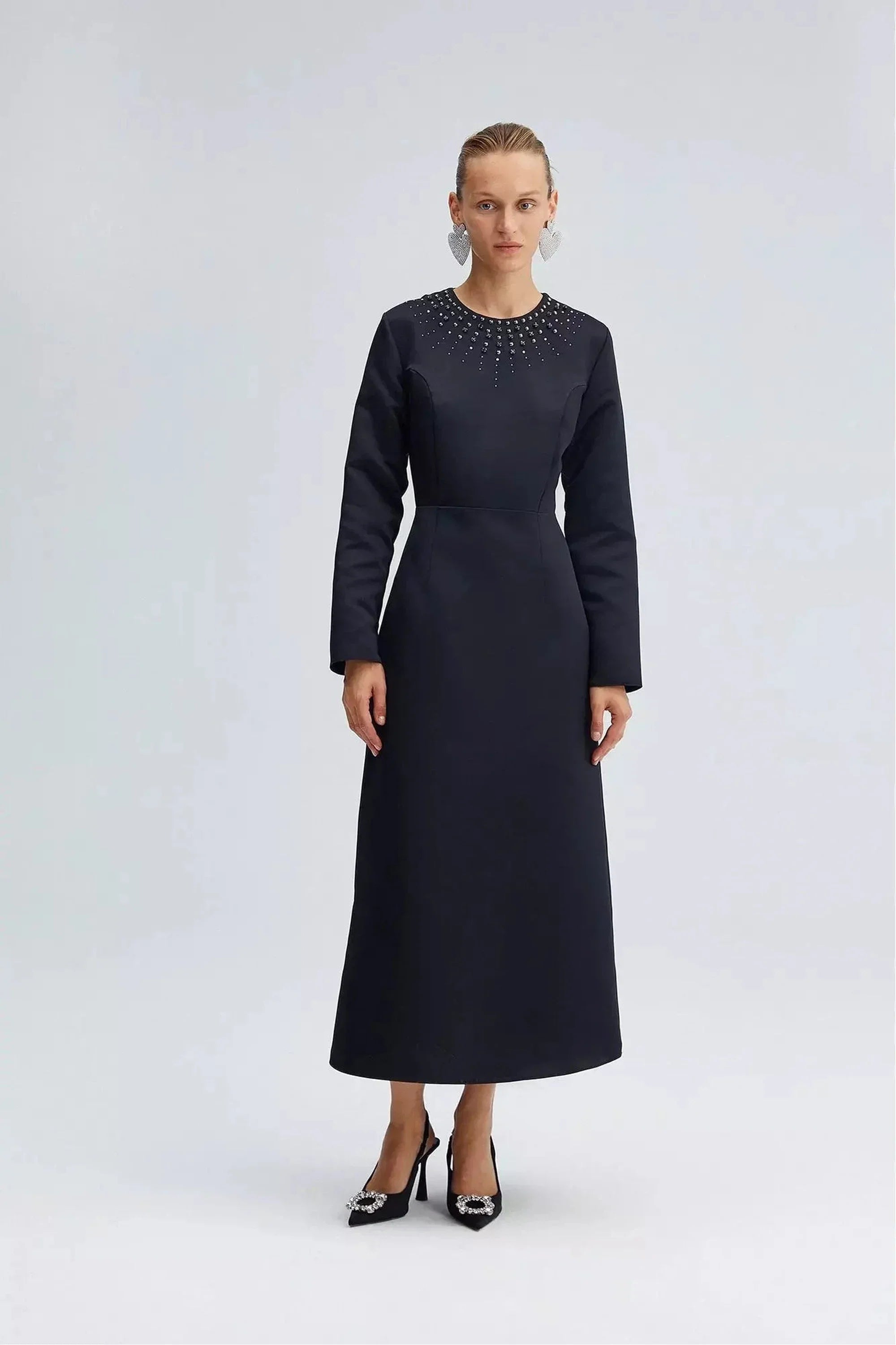 By Baano midnight navy satin midi evening dress with rhinestones, featuring elegant design and sparkling embellishments.