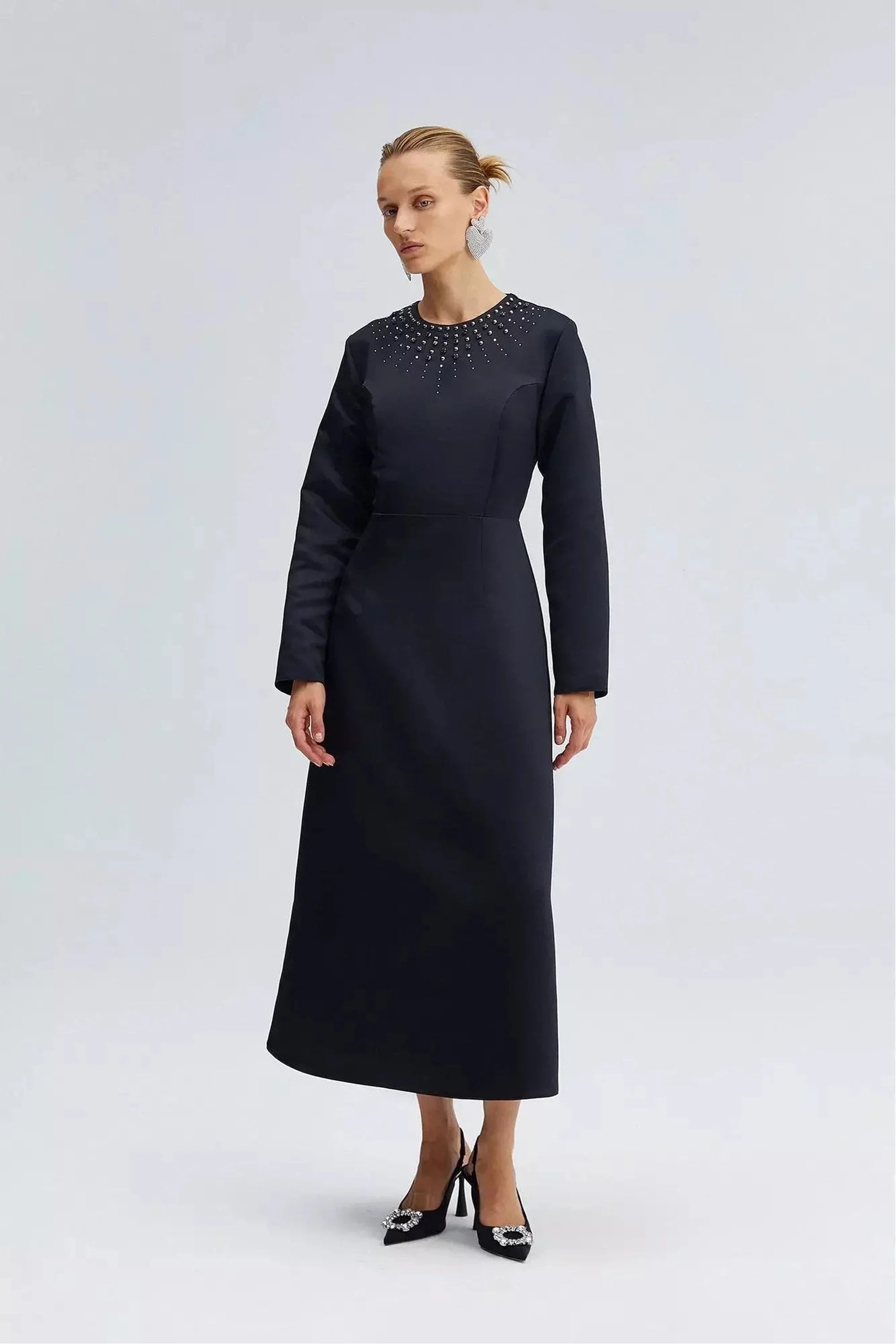 By Baano satin midi evening dress in midnight navy with rhinestones, featuring a sleek, elegant design and a fitted silhouette.