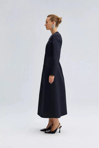 By Baano midnight navy satin midi evening dress with rhinestones, featuring a sleek, elegant design and fitted silhouette.