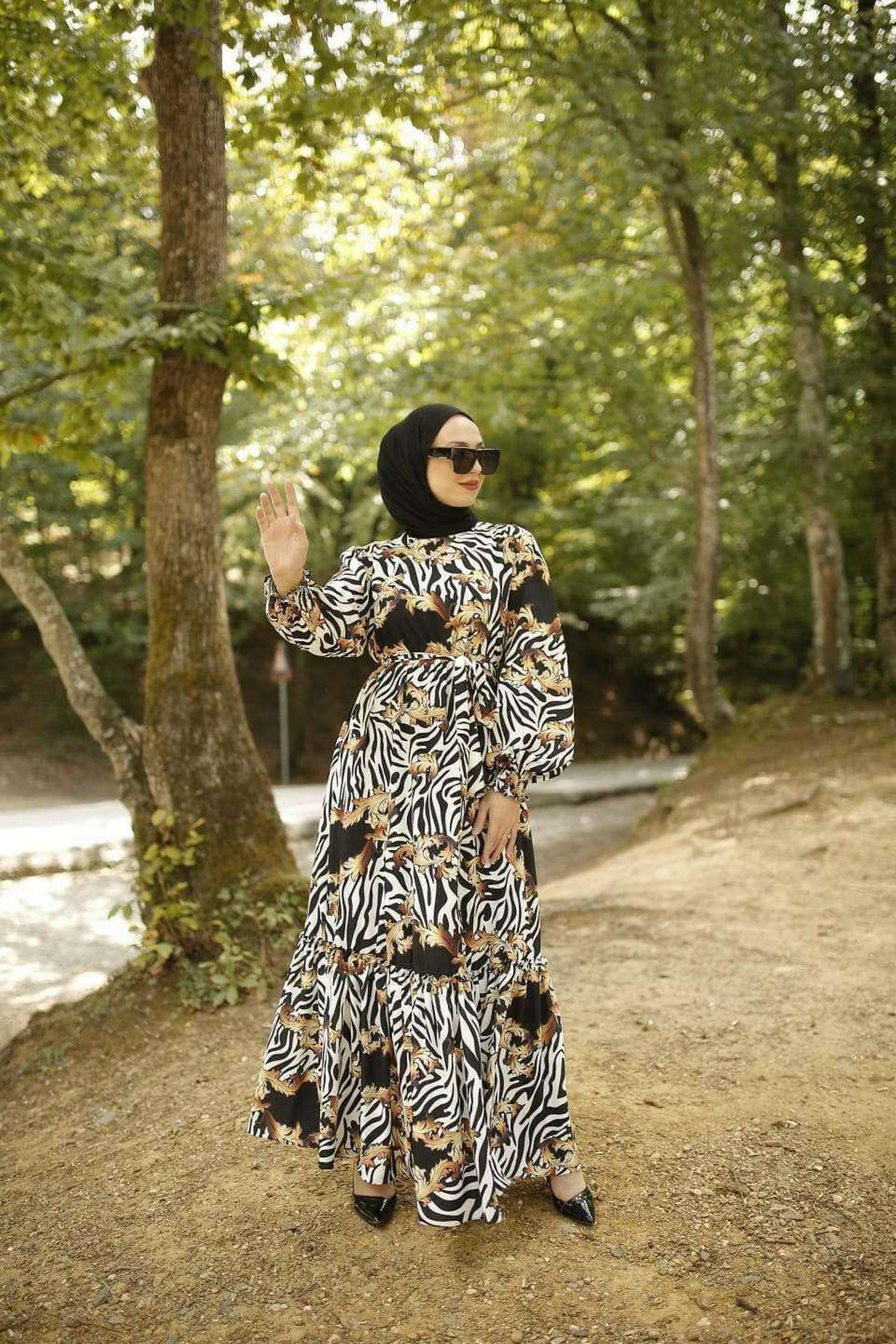 BY Baano Christa long maxi dress with long sleeves, flowing fabric and elegant design, perfect for stylish occasions.