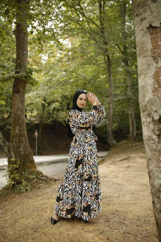 BY Baano Christa long maxi dress with long sleeves, flowing fabric and elegant design, perfect for stylish occasions.