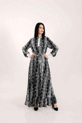 BY Baano Liliana long maxi dress with long sleeves and elastic cuffs, flowing fabric, and elegant style.
