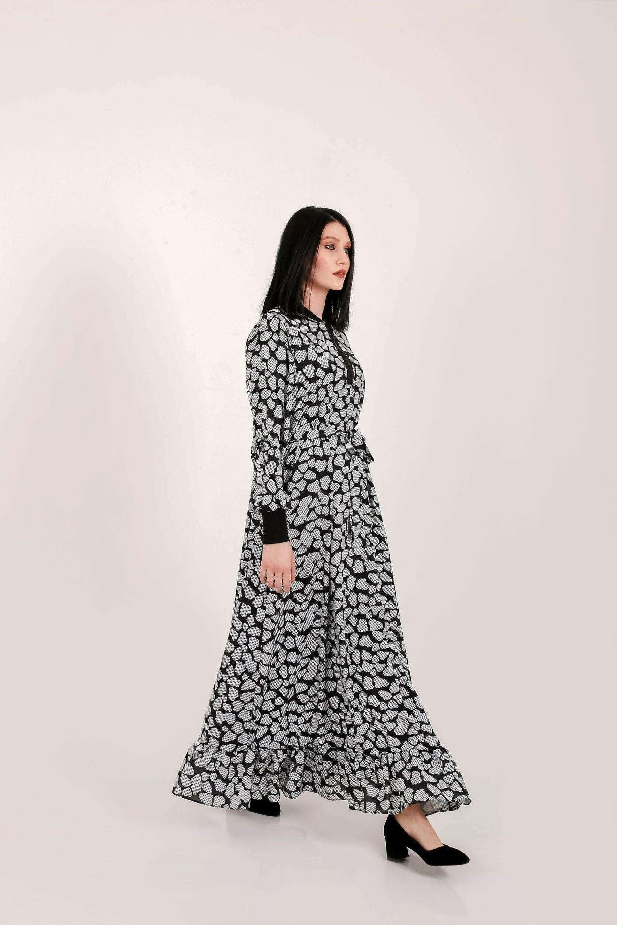 BY Baano Lola long maxi dress with elastic cuffs and neckline, flowing fabric and elegant design, full-length view.