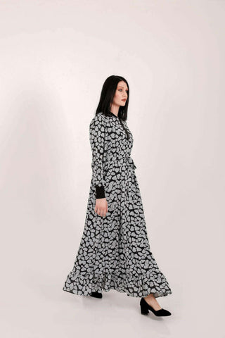 BY Baano Lola long maxi dress with elastic cuffs and neckline, flowing fabric and elegant design, full-length view.