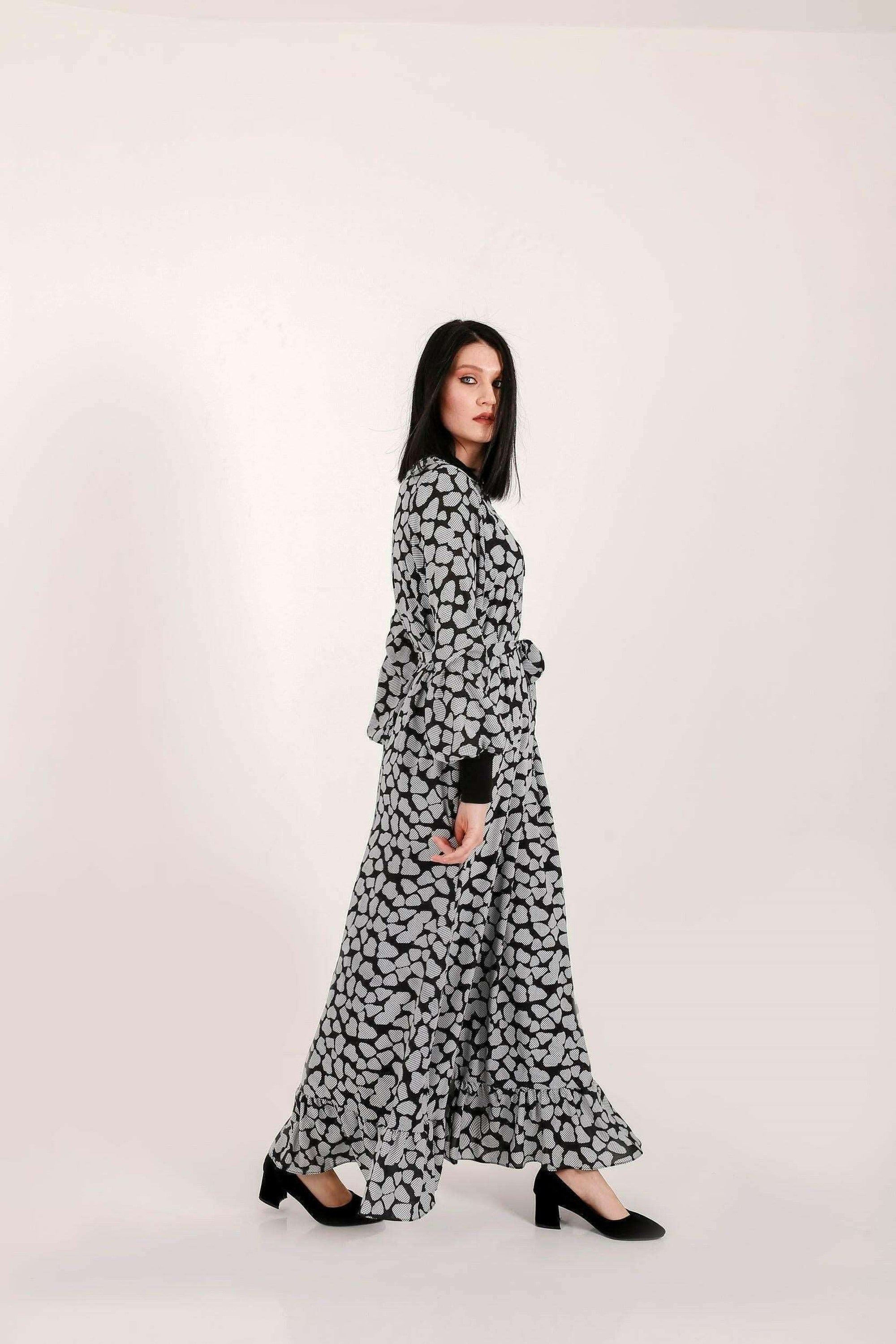 BY Baano Lola long maxi dress with elastic cuffs and neckline, flowing fabric, elegant style, and full-length design.