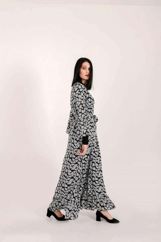 BY Baano Lola long maxi dress with elastic cuffs and neckline, flowing fabric, elegant style, and full-length design.