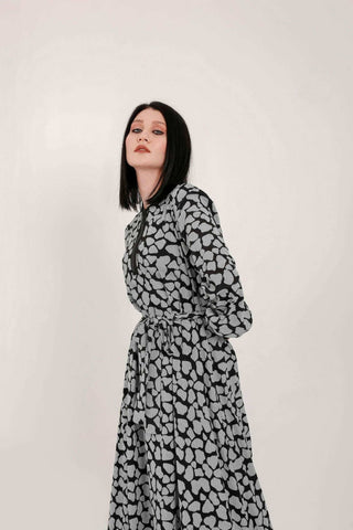 BY Baano Lola long maxi dress with elastic cuffs and neckline, flowing fabric, and elegant design perfect for stylish occasions.