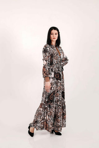 BY Baano paisley maxi dress with long sleeves, flowing fabric, and intricate paisley pattern, perfect for elegant occasions.