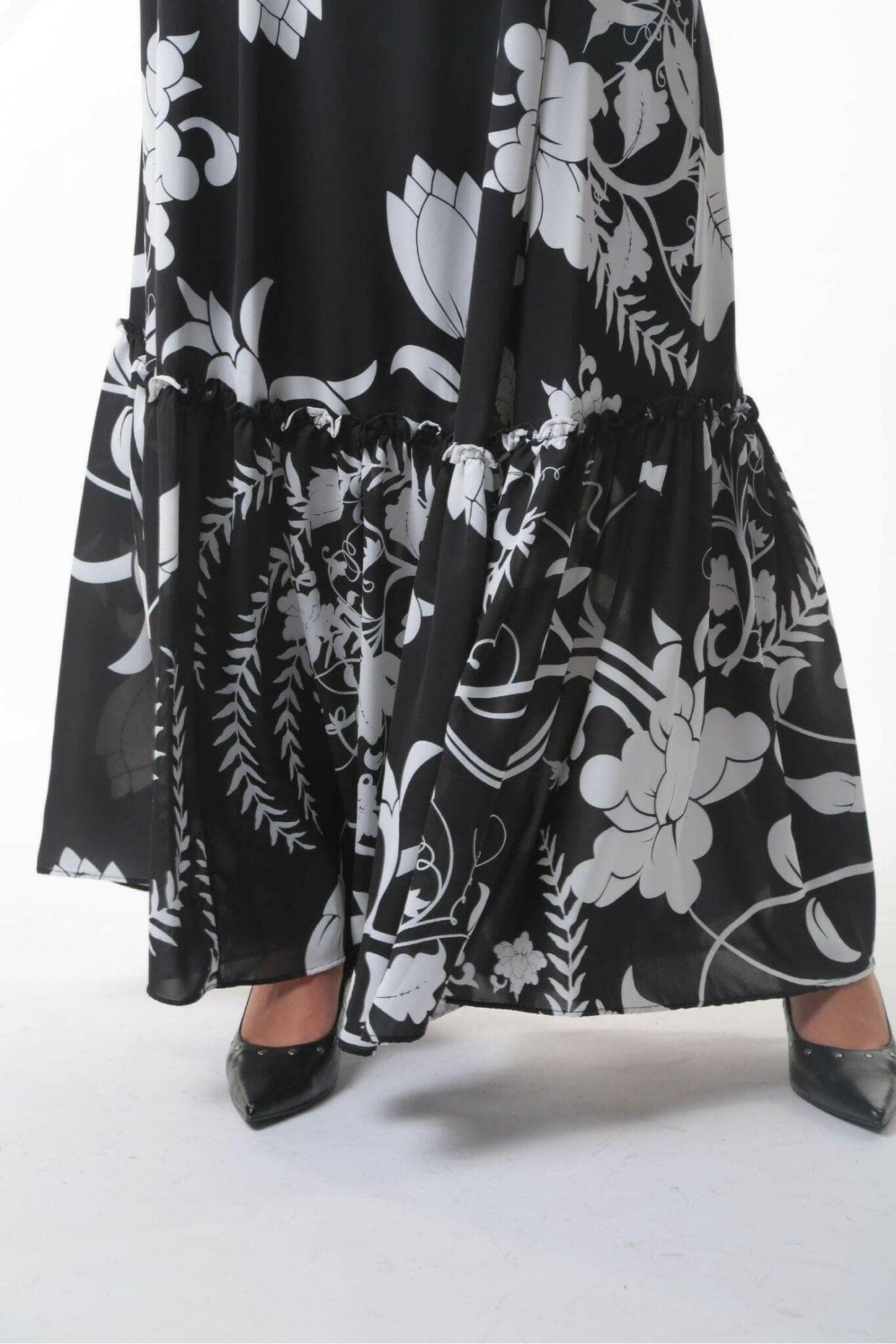 BY Baano Roxy long maxi dress with long sleeves, flowing fabric and elegant design for casual or semi-formal occasions.