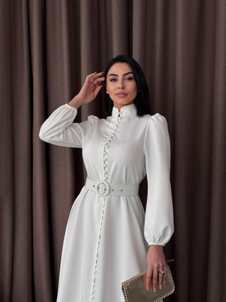 White Temple Maxi Dress by Baano featuring long sleeves and a flowing, elegant design perfect for casual or formal occasions.