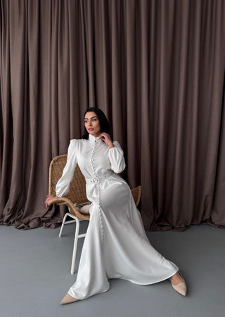 White By Baano Temple Maxi Dress with long sleeves, flowing fabric, and elegant design for casual or dressy occasions.