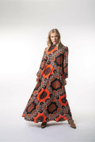 Printed Zara maxi dress with long sleeves by BY Baano, featuring a flowing design and vibrant floral pattern.