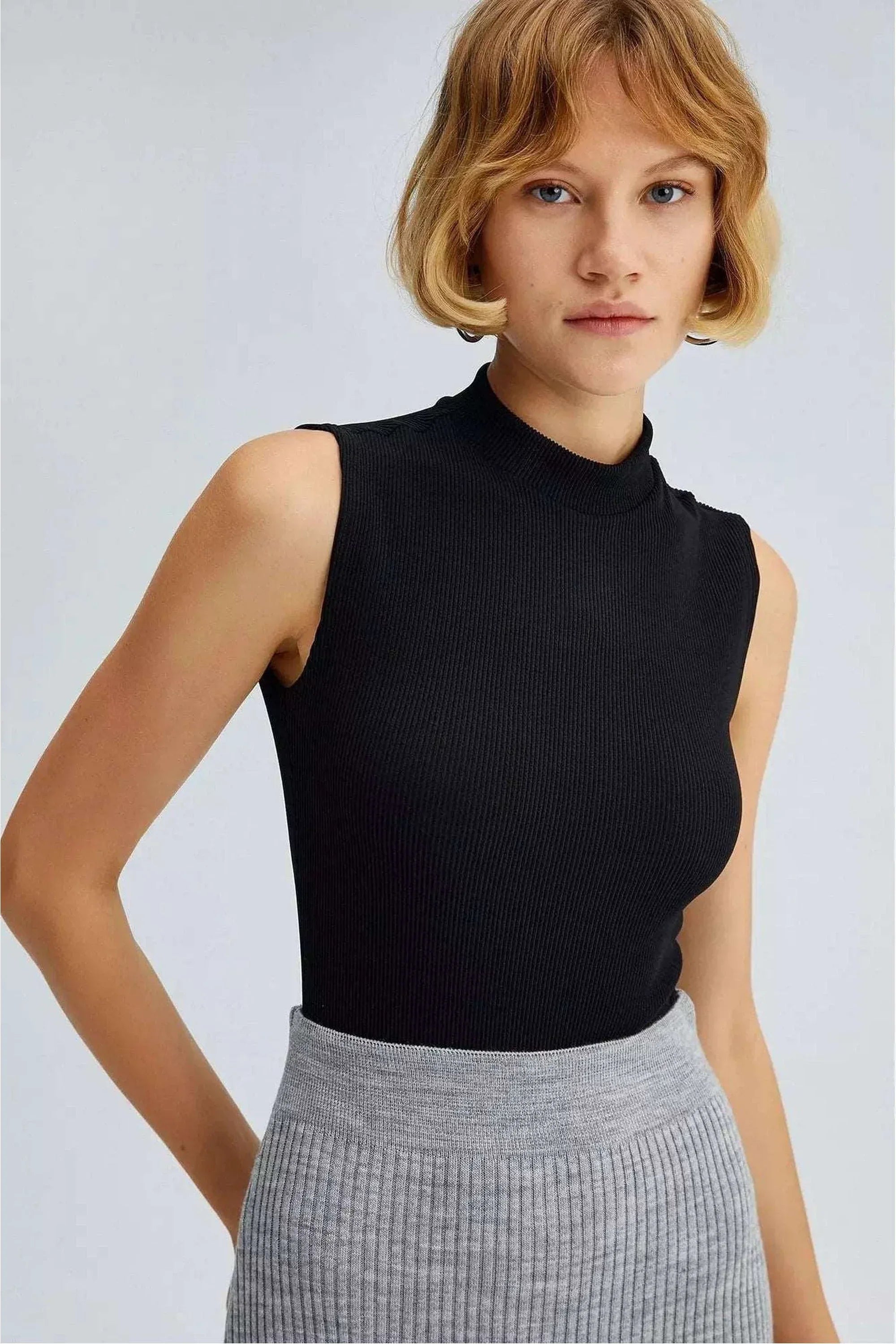 Gray striped knit skirt by By Baano, one-size-fits-all, featuring a cozy, ribbed texture and classic striped pattern.