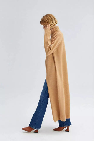 Beige side split knit tunic by By Baano featuring a relaxed fit and stylish side slit, perfect for casual wear.