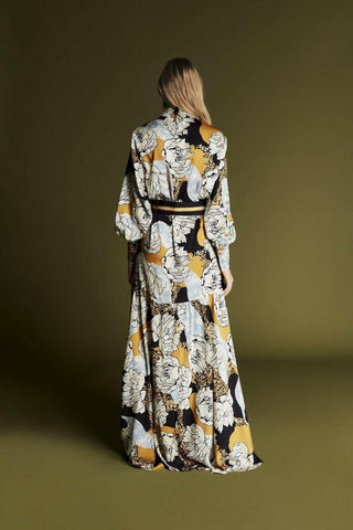 ByBaano Zaha Yellow Floral Print Maxi Dress featuring vibrant floral patterns and flowing fabric.