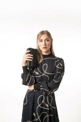 Long Alexia Maxi dress with long sleeves by ByBaano, featuring elegant design and flowing fabric, perfect for formal occasions.