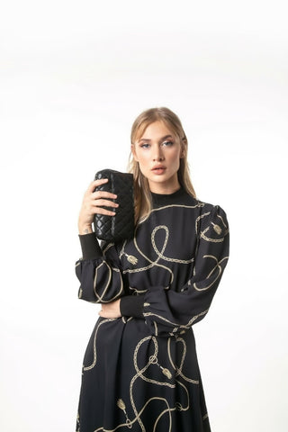 ByBaano Alexia long maxi dress with long sleeves, elegant black Zara-inspired design, flowing fabric and fitted waist.
