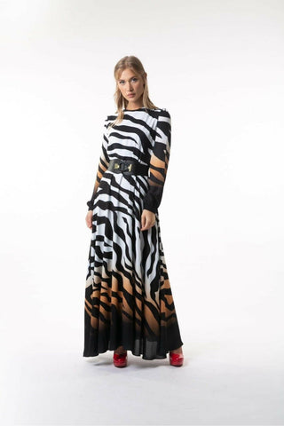 ByBaano Armina long Zara maxi dress displayed on a model, featuring a flowing silhouette and elegant design.