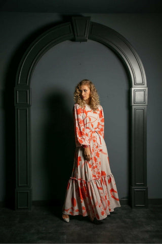 ByBaano Susan Long Maxi Dress shown on a model, featuring a flowing silhouette and elegant design.
