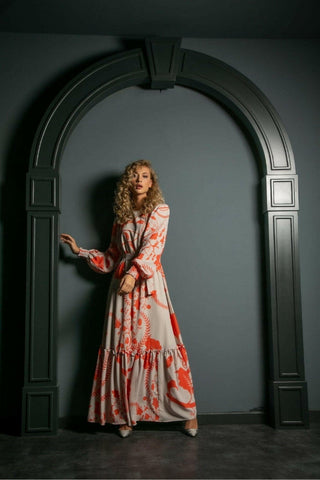 ByBaano Susan Long Maxi Dress shown on a model, featuring a flowing silhouette and elegant design for casual or formal wear.