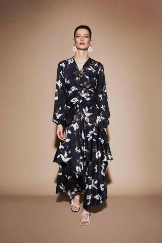 ByBaano Amelia Polly midi dress in lightweight fabric, perfect for summer wear, shown on a model with a flowy design.