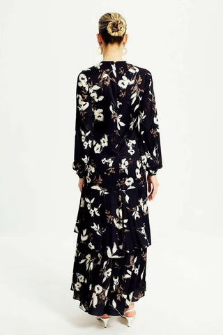 ByBaano Amelia Polly midi dress in lightweight fabric, featuring a stylish summer-ready design with a fitted waist and flowing skirt.
