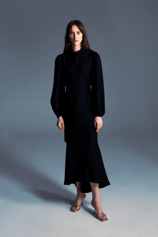 ByBaano Mia black midi dress for women, featuring a stylish and elegant design, shown on a model.