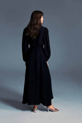 ByBaano Mia black midi dress for women, showcasing a stylish knee-length dress with a fitted silhouette and elegant design.