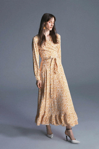 ByBaano Nora Maxi Dress in lightweight fabric, featuring a flowing silhouette, floral pattern, and sleeveless design.
