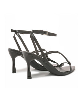 Black Charlene heels by J.Adams shown from the side with a sleek design and pointed toe, perfect for stylish footwear.