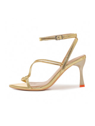 Pair of gold Charlene heels by J.Adams featuring sleek design and stiletto heels, displayed on a neutral background.