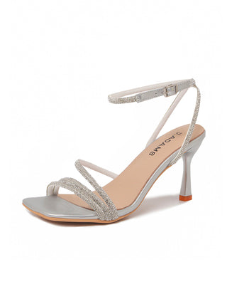 Silver metallic Chloe heels by J.Adams with sleek pointed toes and stiletto heels, shown from a front angle.