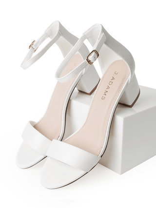 Elegant white satin Daisy heels by J.Adams featuring a sleek design and pointed toe, perfect for formal occasions.