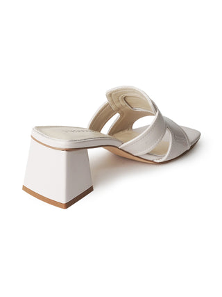 Beige patent Deborah J. Adams sandals with open toes and ankle straps, stylish footwear for casual or dressy occasions.